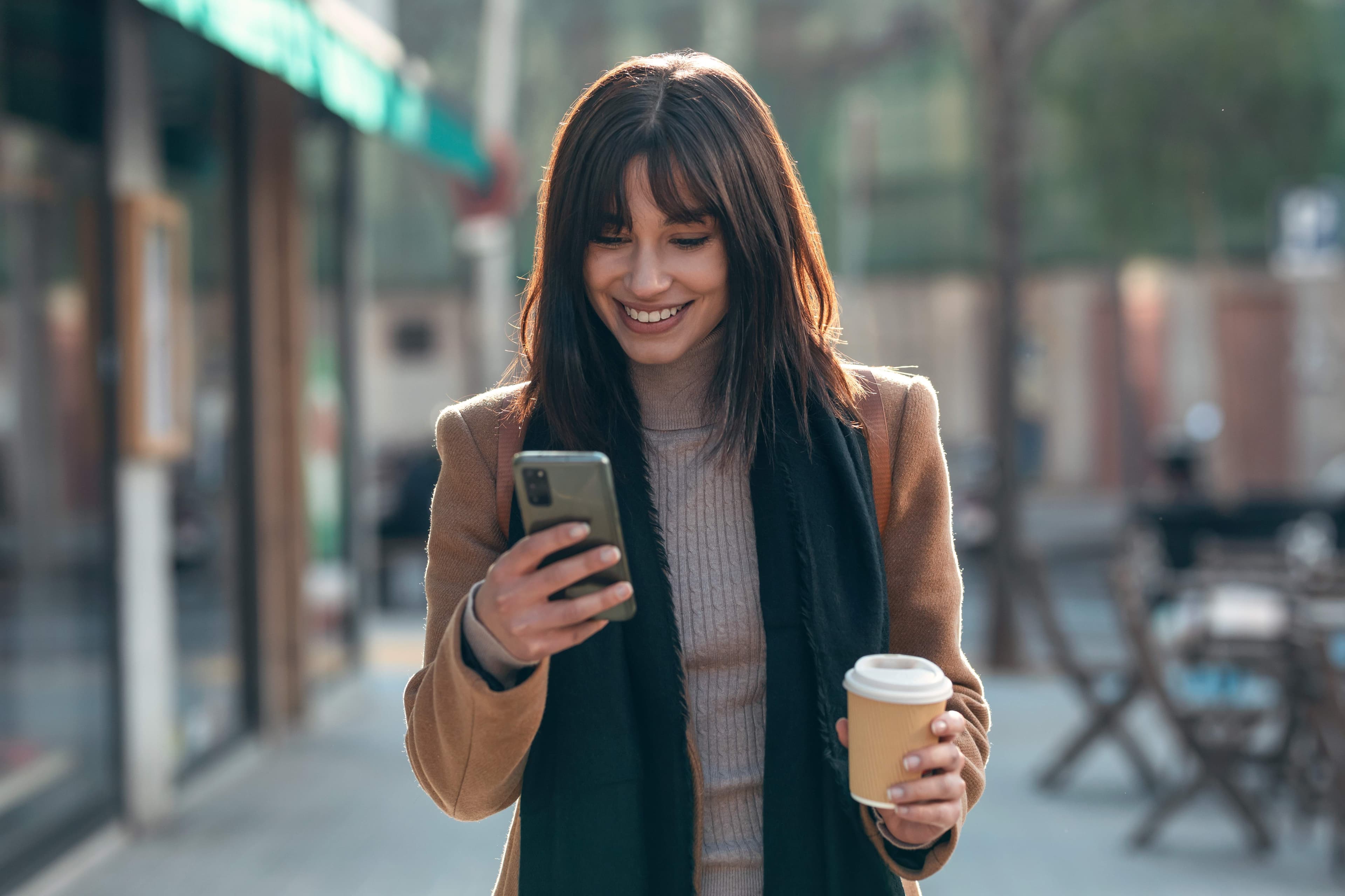 A customer checking her Cliftonbury Bank account on her phone